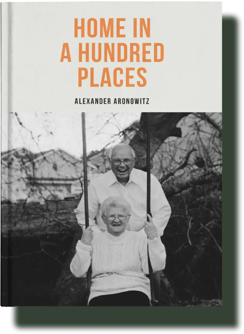 Book cover of 'Home in a Hundred Places' featuring an elderly couple enjoying a joyful moment on a swing, capturing the essence of lifelong memories in a life story book.