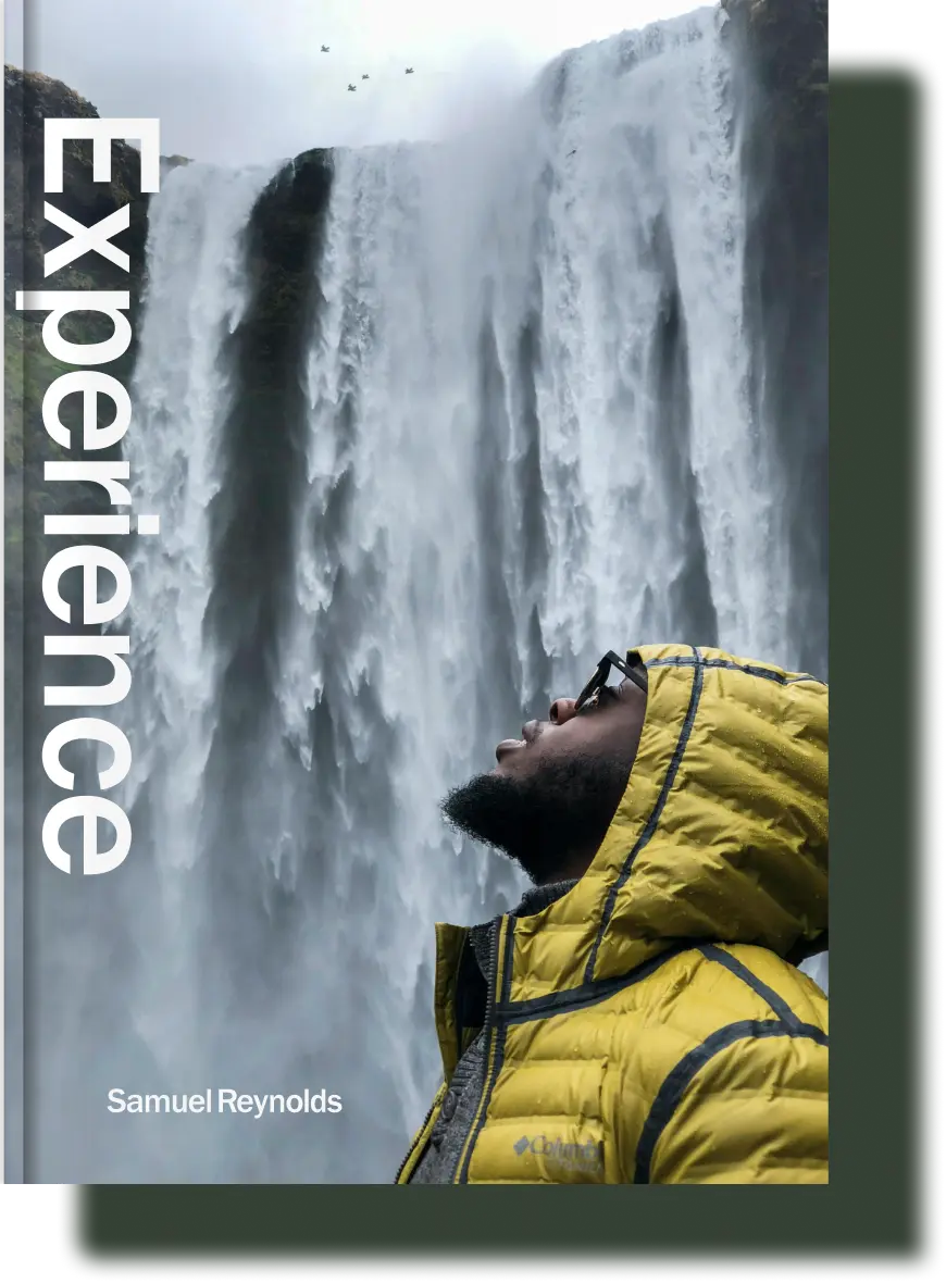 Experience travel memory book cover featuring a traveler standing in front of a powerful waterfall, embracing the beauty of nature and adventure.
