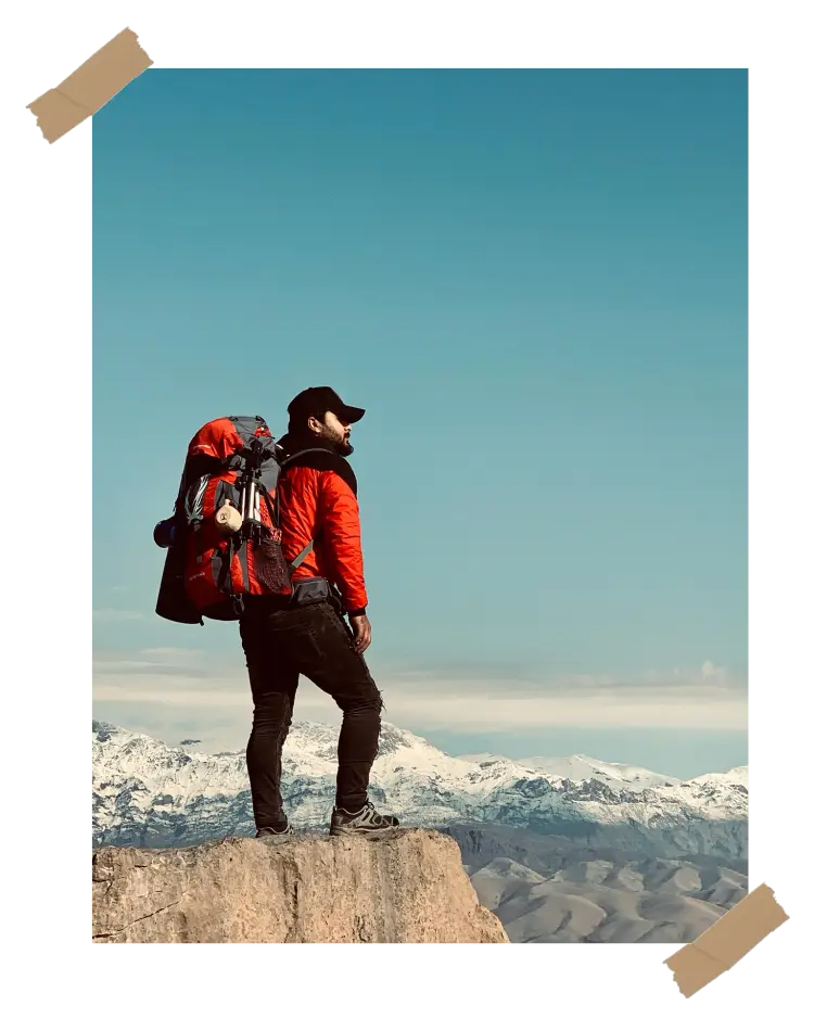A couple hiking through the desert with backpacks, capturing the essence of adventure and exploration for their travel memory book.