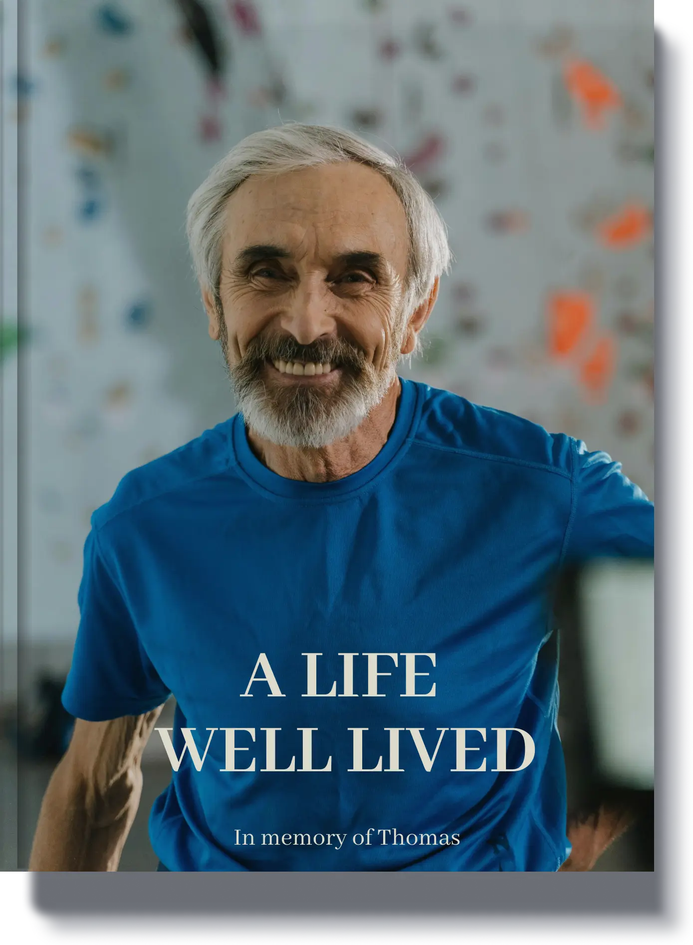 Book cover titled 'A Life Well Lived' featuring a smiling elderly man in a blue shirt, a personalized memorial book in memory of Thomas.